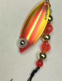 Fishing lure with colorful beads for bass and trout fishing. High-quality, durable tackle for succes.