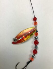 Colorful fishing lure with beads and hook for freshwater or saltwater fishing.