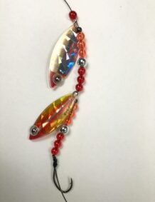 Premium fishing lure with colorful beads and holographic fish design for effective fishing.
