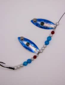 Fishing lure with beads and hooks for freshwater and saltwater fishing.