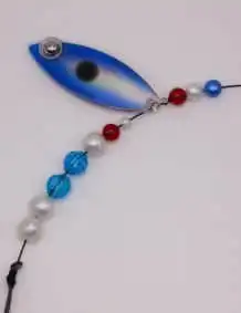 Fishing lure with beads and hook for freshwater or saltwater fishing.