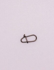 Fishing tackle clip for secure line attachment.