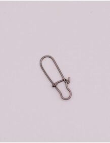 Close-up of a fishing swivel, essential for secure fishing line connections.