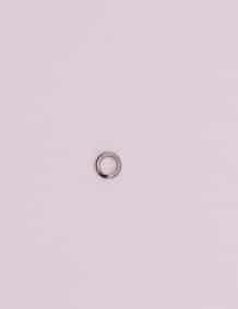 Up of a fishing tackle ring on a plain background.