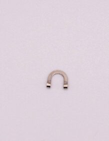 Shaped fishing hook component for tackle and bait setup.