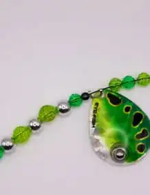 Green fishing lure with beads and swivel for freshwater fishing.