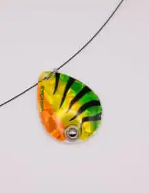 Brightly colored fishing lure with a reflective surface and treble hook for attracting fish.