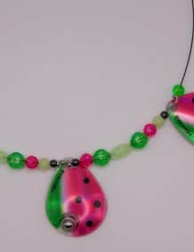 Elegant fishing tackle jewelry featuring ladybug-shaped pendants and colorful beads for anglers.