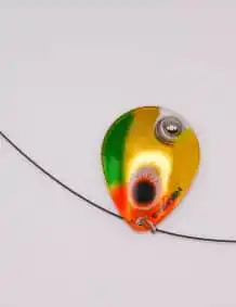 Colorful fishing lure with spinner for freshwater and saltwater fishing.