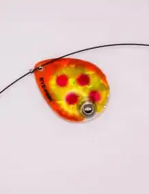 Bright orange and yellow fishing lure with red accents, designed for attracting fish.