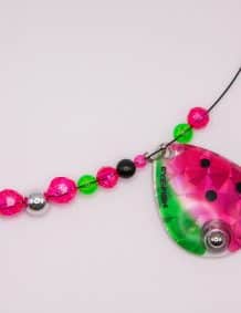 Fishing lure with colorful beads and a pink-green teardrop-shaped bait.
