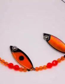 Fishing lure with orange and black design, perfect for freshwater fishing and catching bass.