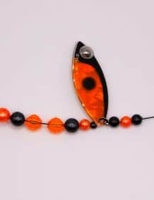 Fishing lure with beads and line for freshwater fishing.