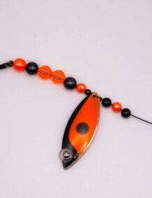 Fishing lure with beads, hook, and spinner for freshwater fishing.