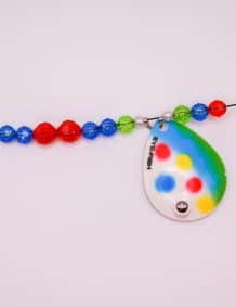 Colorful fishing lure with beads and a reflective spoon.