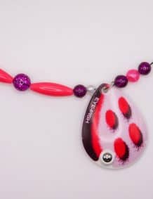Elegant fishing tackle jewelry with colorful beads and a ladybug pendant.